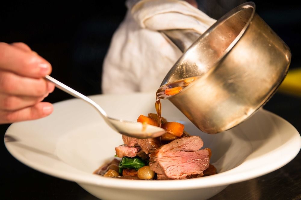 The Millstone, Mellor Hotel Blackburn  Luaran gambar A chef plating a dish
